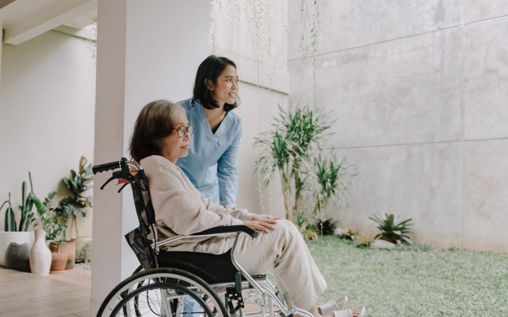 nurse with elderly senior woman in wheelchair
