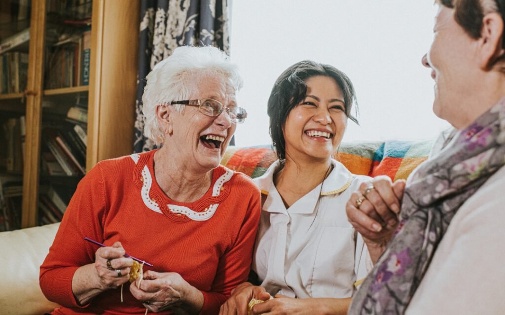 elderly care family laughing and smiling