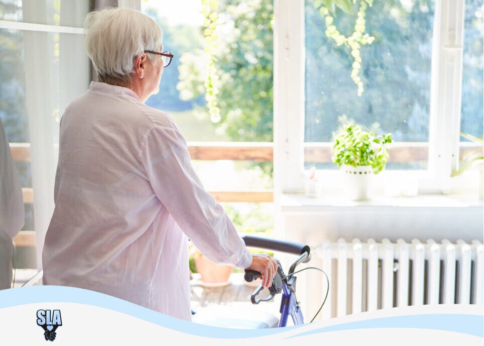 elderly woman with walker looking out window